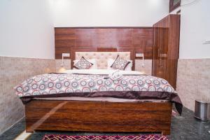 Postel nebo postele na pokoji v ubytování Golden Residency