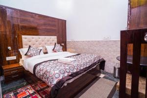 Postel nebo postele na pokoji v ubytování Golden Residency
