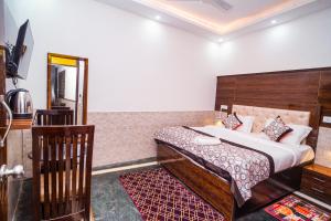 Postel nebo postele na pokoji v ubytování Golden Residency