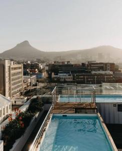 a building with two swimming pools on top of it at The Heaven on Earth Hosted By Jose & Teresa in Cape Town