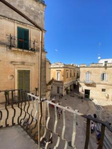 a group of people walking down a street at Roiss Haus Suites in Lecce