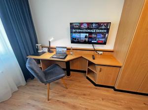 TV a/nebo společenská místnost v ubytování HIL - Hotel im Lus Schopfheim