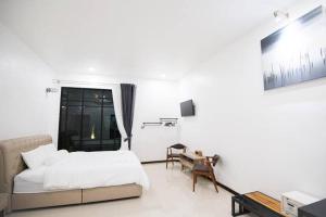Postel nebo postele na pokoji v ubytování Na Klongluang Boutique Resort