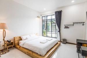 Postel nebo postele na pokoji v ubytování Na Klongluang Boutique Resort