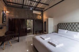 Postel nebo postele na pokoji v ubytování Na Klongluang Boutique Resort