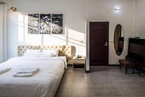 Postel nebo postele na pokoji v ubytování Na Klongluang Boutique Resort
