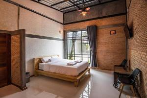 Postel nebo postele na pokoji v ubytování Na Klongluang Boutique Resort + 24 fotografií