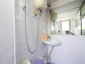 a bathroom with a shower and a sink at DawnsMelody in Mumbai