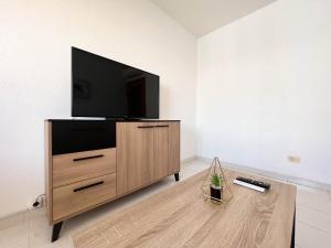 TV a/nebo společenská místnost v ubytování Espacio ideal en la Playa