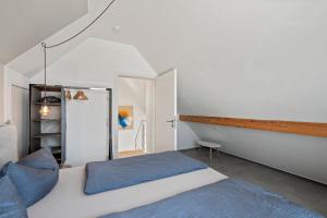 Ein Bett oder Betten in einem Zimmer der Unterkunft SEEview Maisonette in direkter Seenähe