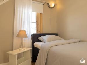 Säng eller sängar i ett rum på Rustic Villa in Central Piteå