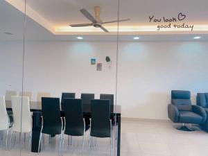 a conference room with a table and chairs and a ceiling fan at Big Happy Family @ Sri Petaling/Axiata Stadium in Kuala Lumpur +47 photos