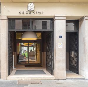 an entrance to a building with a revolving door at Kazakiwi in Luxembourg