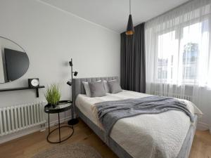 Postel nebo postele na pokoji v ubytování Cozy Apartment in Old Town Tartu + 15 fotografií