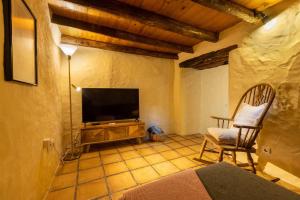 A television and/or entertainment centre at Casa El Barranco