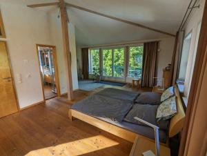 a bedroom with a bed and a large window at "Buena Vista" Ashausen/Hamburg in Stelle