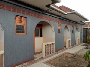 a model of a house with arches on the side at City Cottages Mbale in Mbale