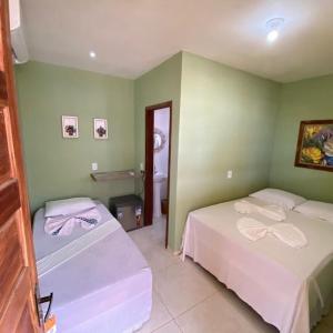 Postel nebo postele na pokoji v ubytování Sol Hostel & Pousada Maragogi