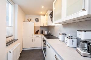 Nhà bếp/bếp nhỏ tại Ferienhaus Seeblick FEWO 10