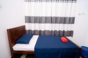 Voodi või voodid majutusasutuse East Gate 8-9 Batticaloa toas