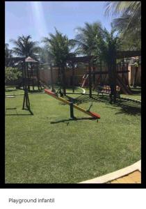 a park with a playground with a play equipment at Apto Completo - Vila do Mar - Beach Park - PDD in Aquiraz