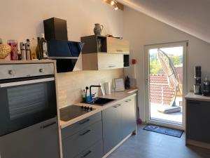a kitchen with a sink and a counter top at Dachterrassenwohnung Alois in Passau