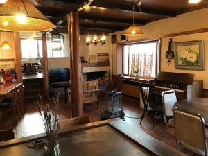 a dining room with a table and a bar at New Togakushi Sea Hail - Vacation STAY 51752v in Nagano