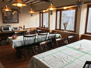 a dining room with tables and chairs and windows at New Togakushi Sea Hail - Vacation STAY 61014v in Nagano