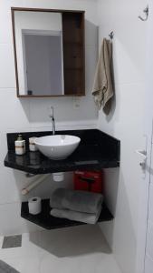 Ένα μπάνιο στο Pé na areia