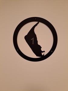 a sign with a silhouette of a woman at Ferienwohnung-1-Nei-Stich-19a in Norddorf