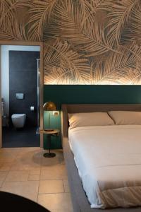 a bedroom with a bed and a bathroom with a tub at Spazio SIMA Space 2 - 2 in Milan