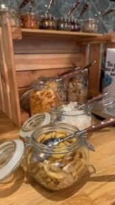 a group of jars of food on a table at Nybro Stora Hotellet in Nybro