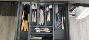 a drawer full of utensils in a drawer at loft industriel L'Idaho in Sarreguemines