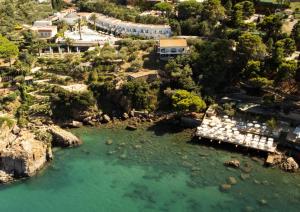 an aerial view of a resort next to a body of water at Le Calette Bay in Cefalù