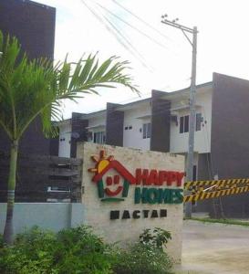 a sign for a happy home median in front of a building at Miestee's Happy Homes in Lapu Lapu City