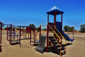 a playground with a slide in a park at BIG4 Stuart Range Outback Resort in Coober Pedy