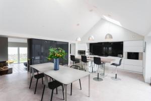 a kitchen and dining room with a table and chairs at Slate House in Ballybunion