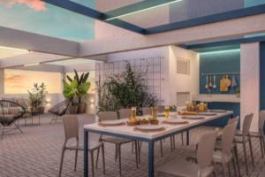 a dining room with a table and chairs at Studio Duque Master in Porto Alegre
