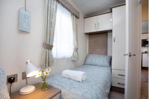 Postel nebo postele na pokoji v ubytování Sunrise