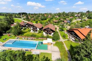 an aerial view of a resort with a swimming pool at Feriendorf Reichenbach - Wieselweg 5 in Nesselwang