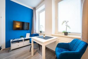 TV/trung tâm giải trí tại APARTMENTO blue Magdeburg - Zentral - WiFi - Netflix