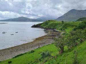 a view of a body of water with boats in it at Hillend Self-Catering in Portree