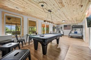 a living room with a pool table in it at Hidden Forest Spa Sauna Nature Secluded 93 acres in Sevierville