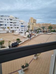 a view from the balcony of a building with a parking lot at Casa de Perlas in El Campello +4 photos