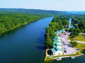 an aerial view of a river with a resort at Perfect Lake Retreat in Hot Springs