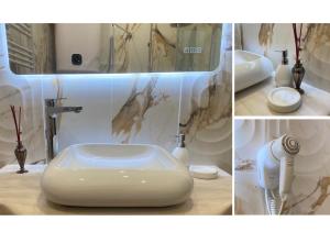 a bathroom with a white sink and a counter at Villa Sérénité appartement au centre ville n 5 in Lourdes