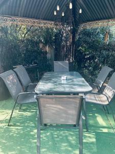 a table and chairs sitting in front of a fence at Revenir in Middelburg