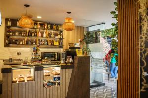 a kitchen with a counter and a counter at First Class Hotel in Medellín