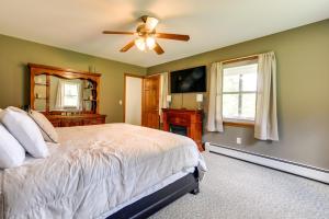 a bedroom with a bed and a ceiling fan at Vermont Vacation Rental about 11 Mi to Lake Willoughby in East Charleston