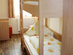 a bedroom with two bunk beds in a room at Kirschblüte in Colmberg